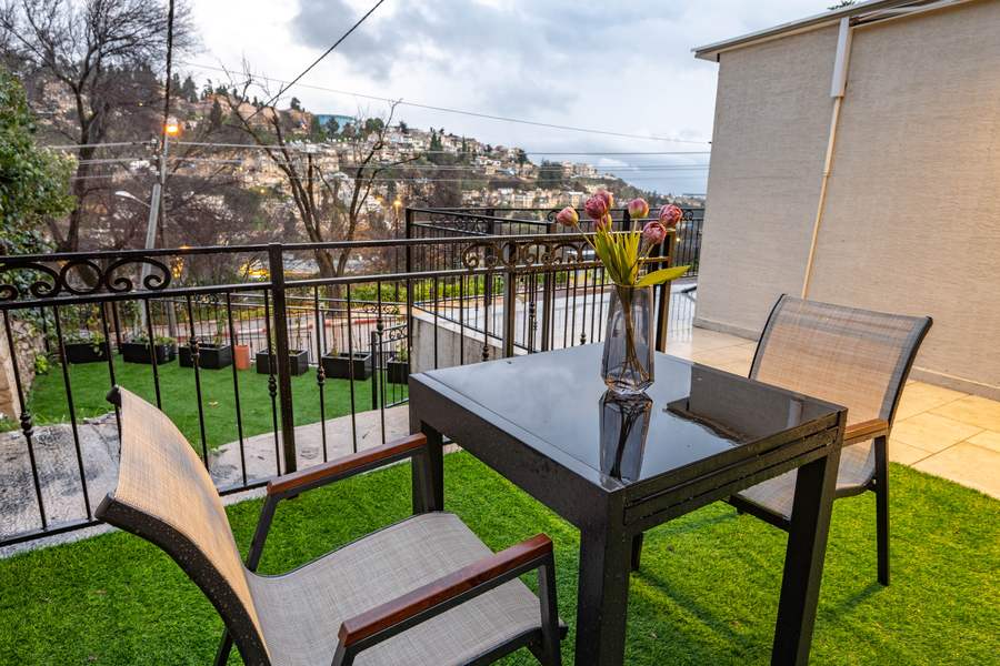 Terrace dining table with hillside view