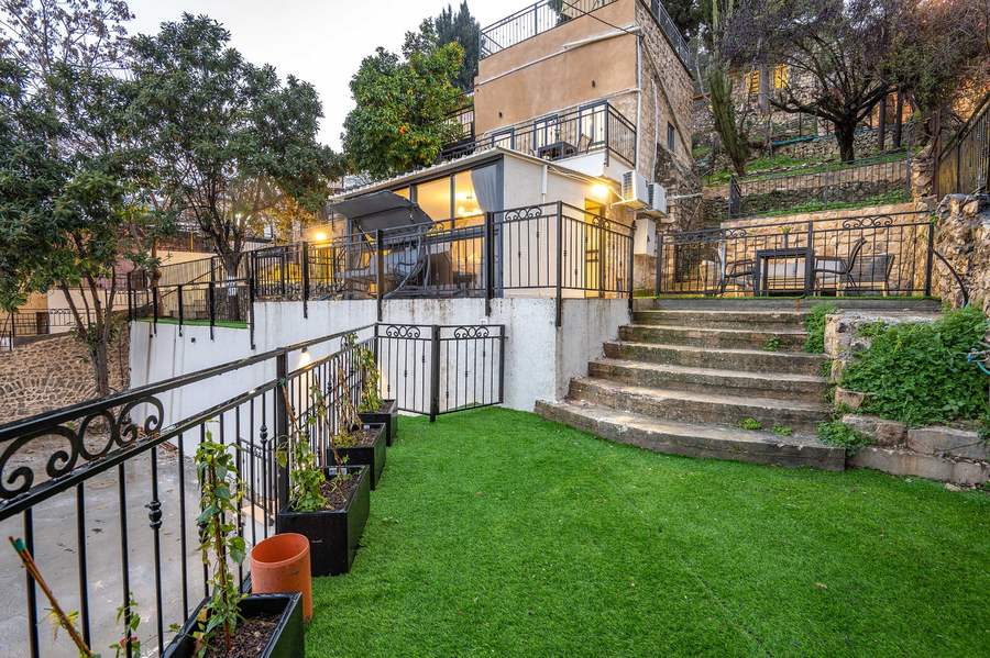 Garden and tiered exterior at dusk