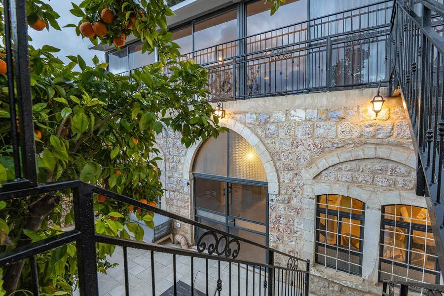 Historic stone facade with citrus trees
